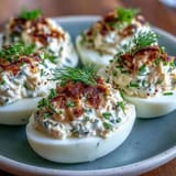 Smoked salmon deviled eggs garnished with everything seasoning, offering a savory and elegant appetizer.