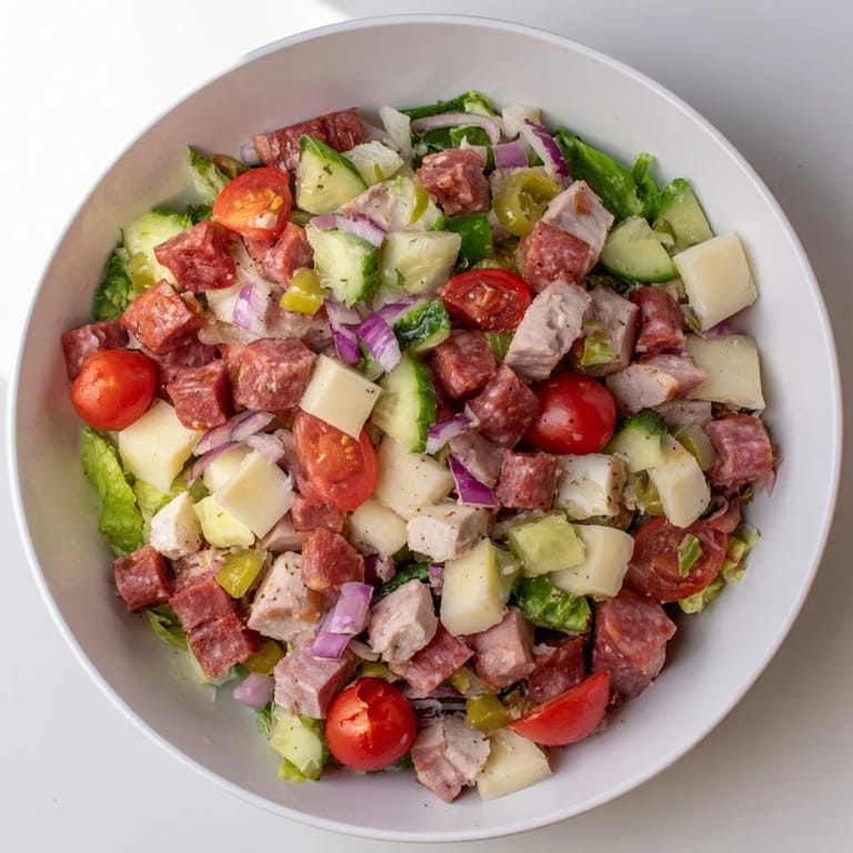 A vibrant Italian Deli Chopped Chicken Salad featuring crunchy veggies, tangy pepperoncini, and a bright olive oil vinaigrette.